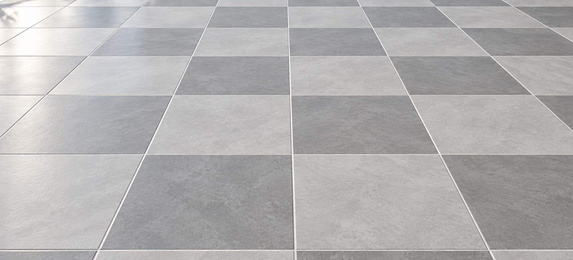 Clean grey tiled floor with bright grout lines showing restoration results